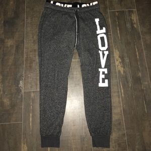 Dark grey joggers with white letters