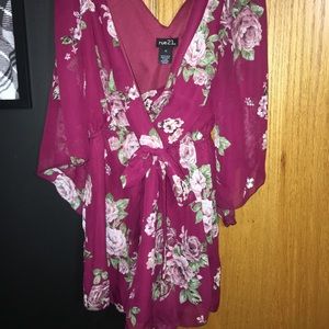 Purple floral romper SIZE: XS but fits a medium