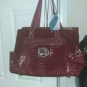 NWT Red Kathy Van Zeeland carry-on bag.