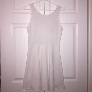 Ginger G white dress with texture and dip in back