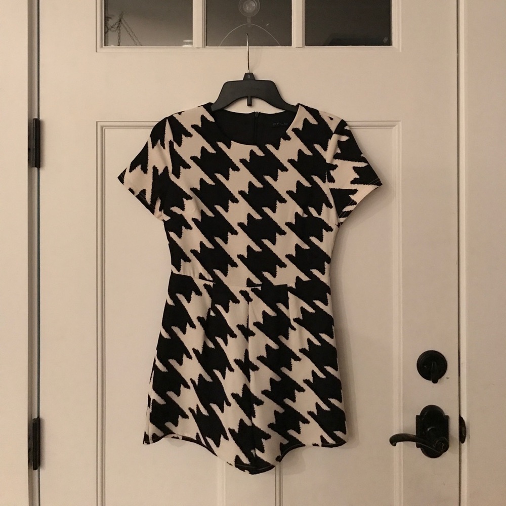 Black and white houndstooth romper. Brand New.