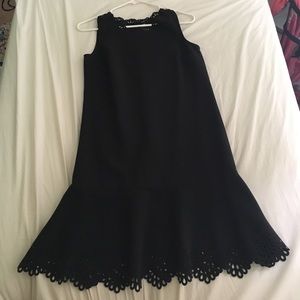 Black sleeveless boxy dress with cut-out detailing