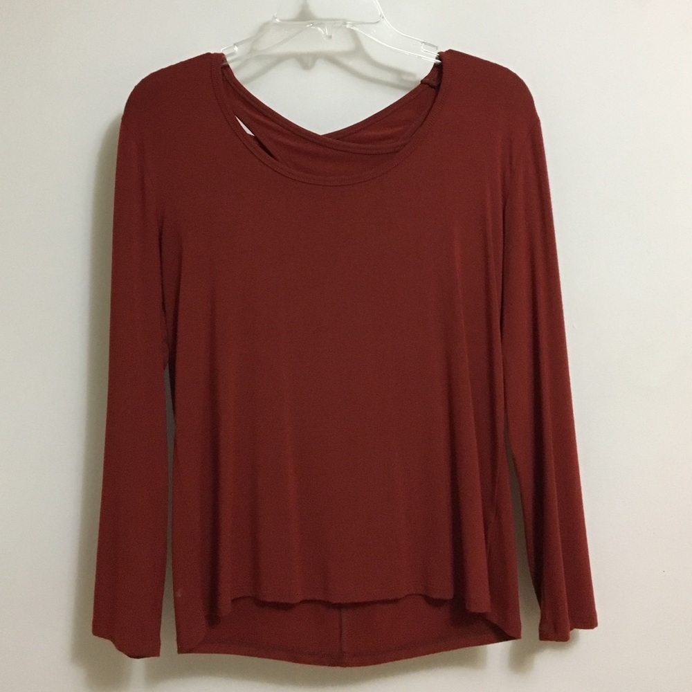 Red long sleeve with cute opening in back.