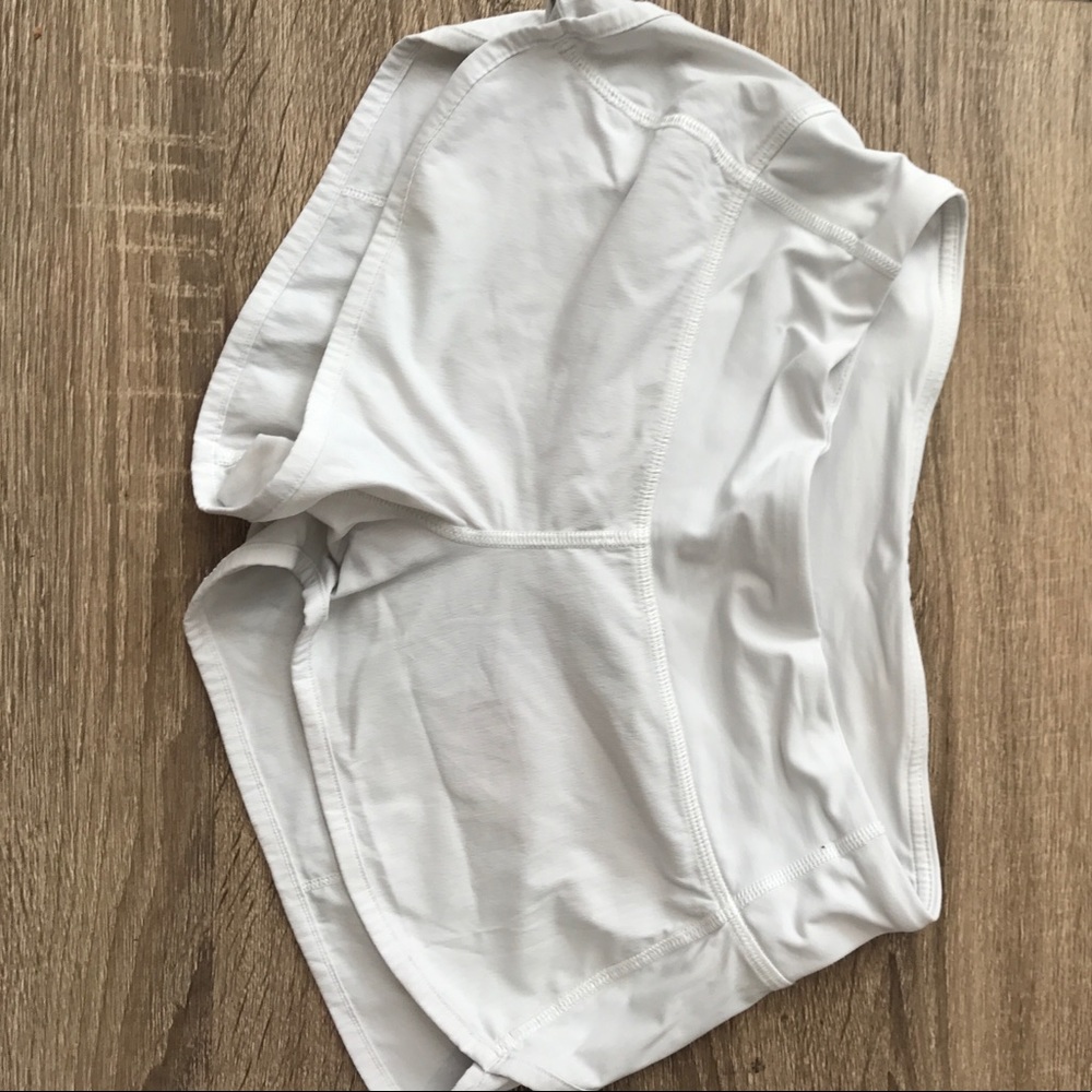 White LuLulemon running shorts