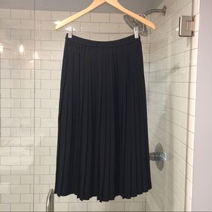 Pleated black midi skirt