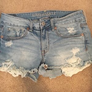 Jean shorts with lace detail on pockets