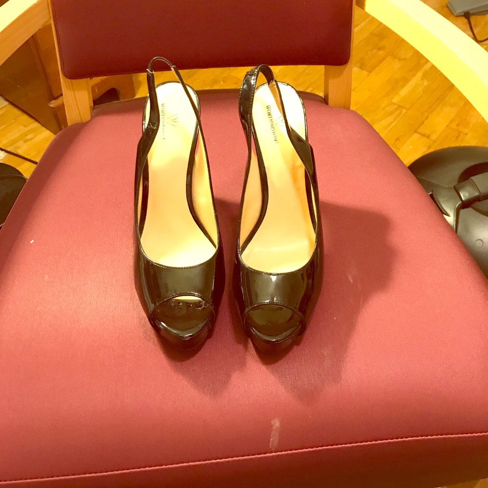 Black sling back peep toe heels.