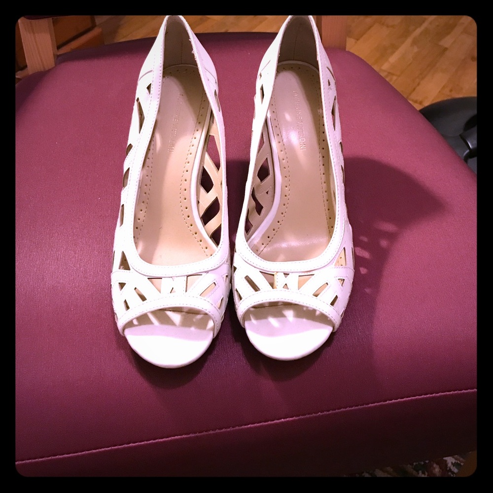White cutout peep toe heels.