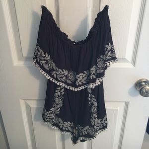 Black strapless romper with white lace detial
