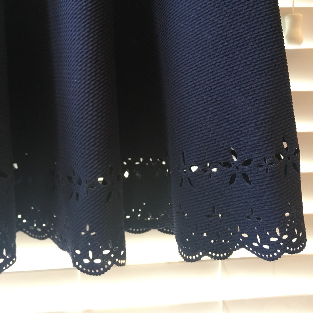 Adorable navy dress with hem detail