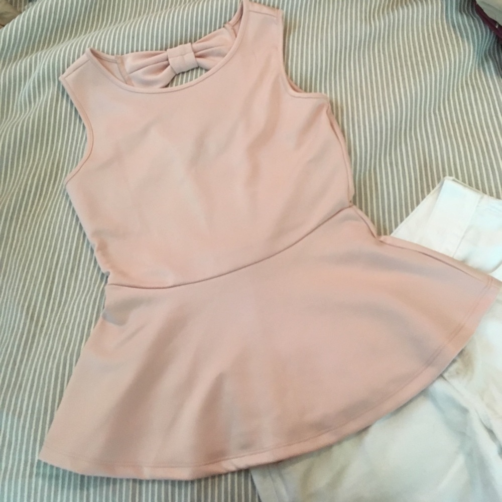 Blush peplum with 🎀and keyhole