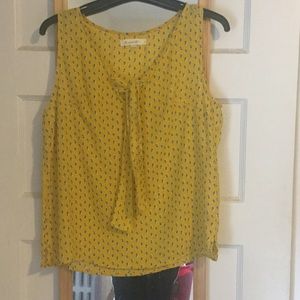 Super cute yellow sleeveless top with tiny tulips.