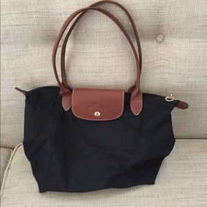 Black Longchamp Le Pliage tore
