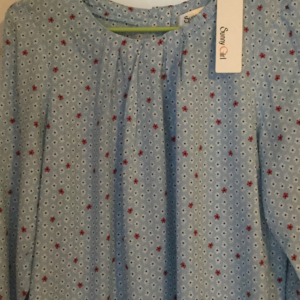 Sunny Girl long sleeve top with button back.