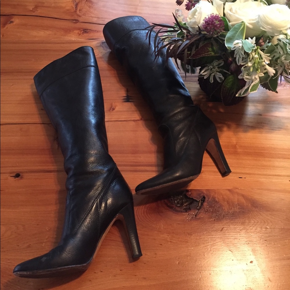 Black leather knee high heeled boots