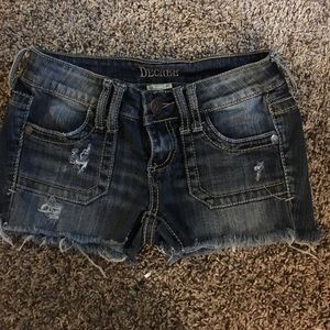 Distressed decree shorts size one