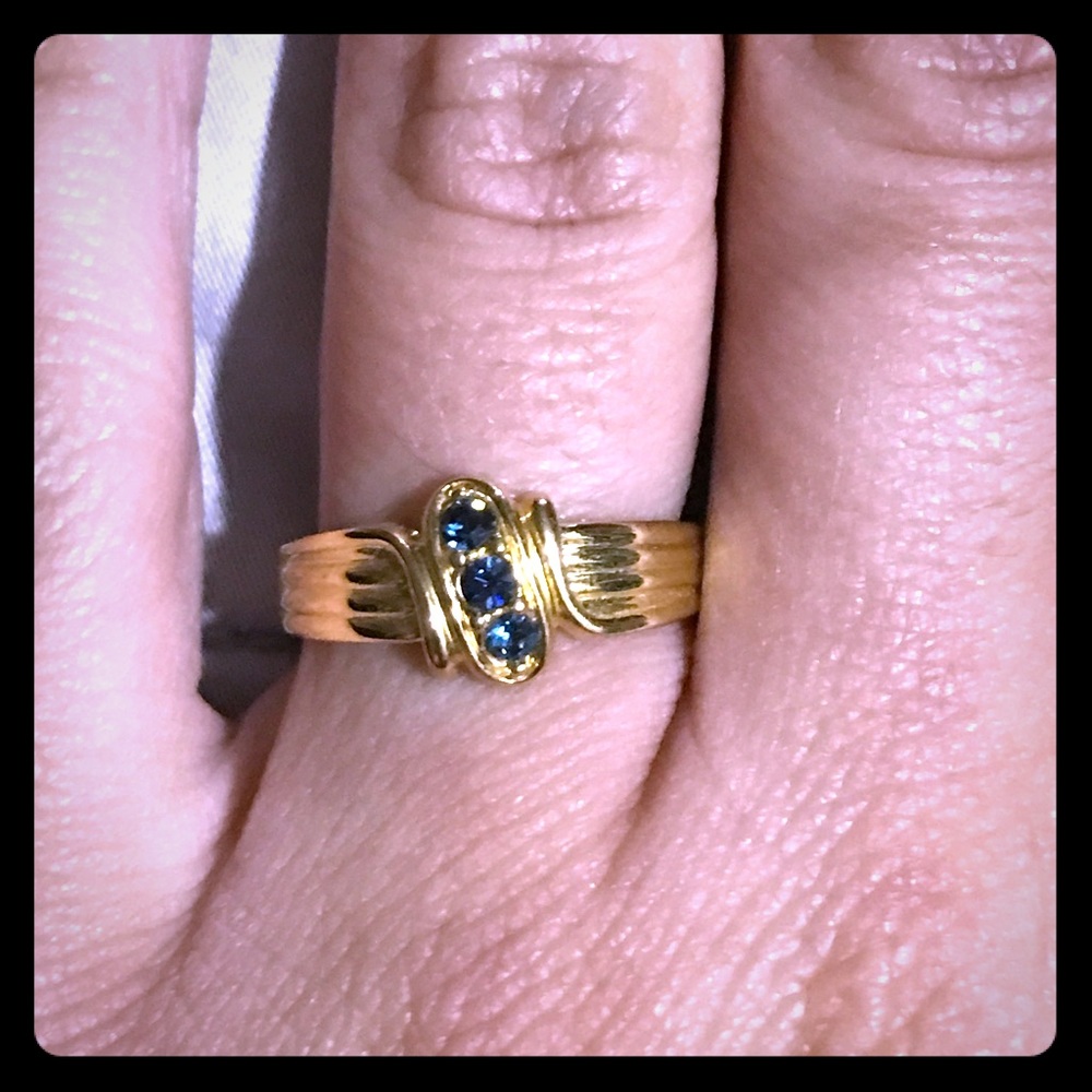 Gold ring with three blue stones