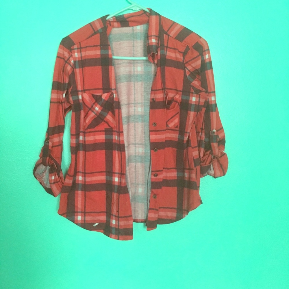 A red brown and white Flanagan shirt bottom down