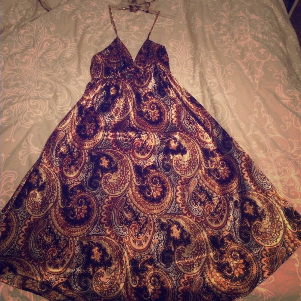 Patterned black and gold halter dress