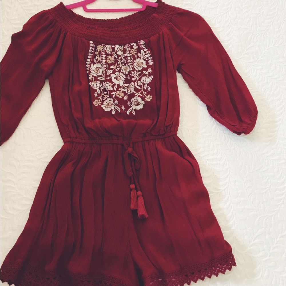 A dark red colored romper from Abercrombie