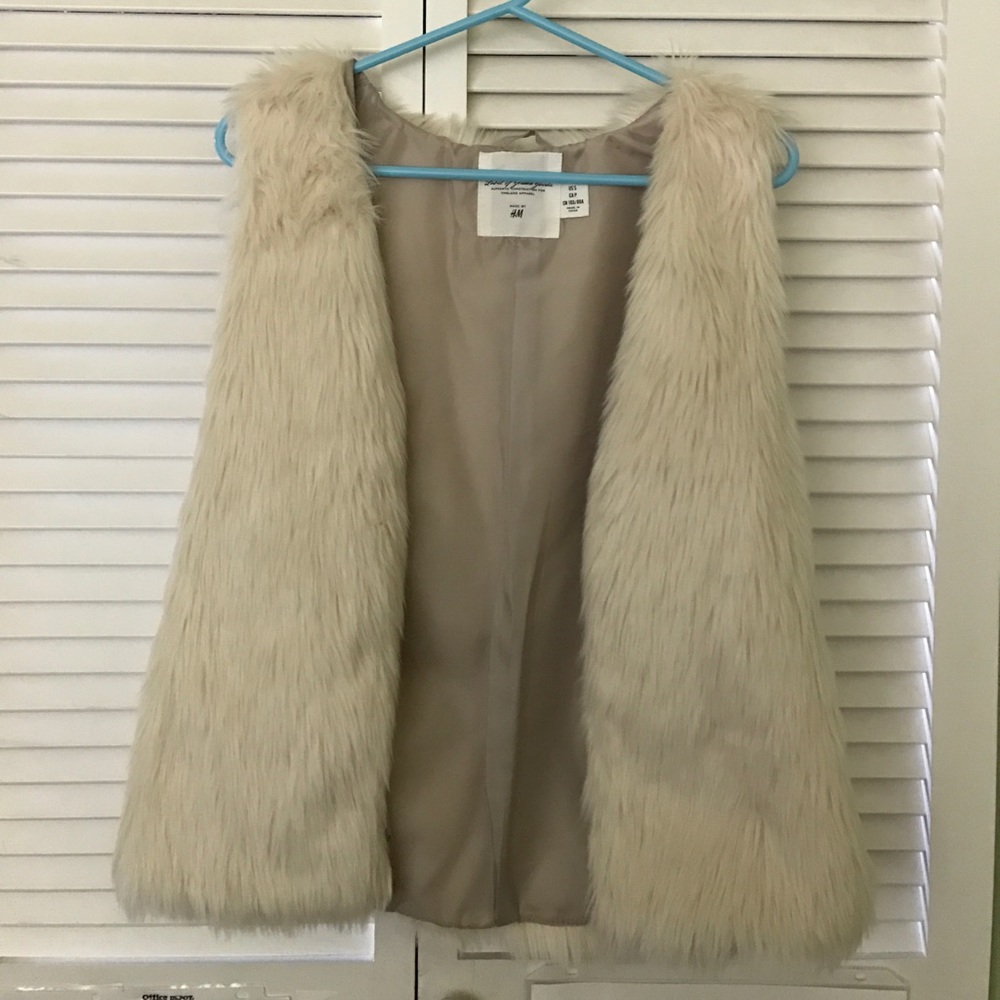 White fur vest