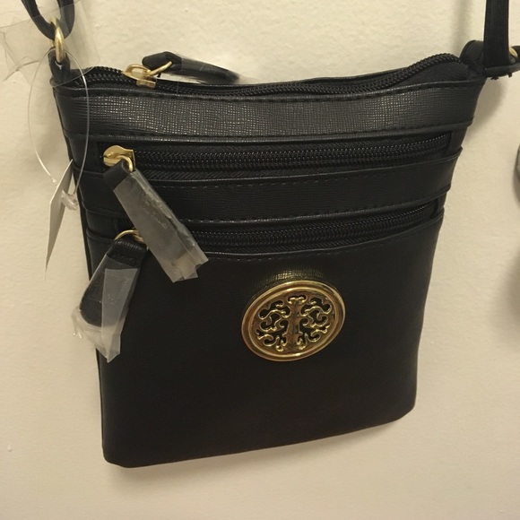 Handbags - NWT black crossbody handbag with adjustable strap