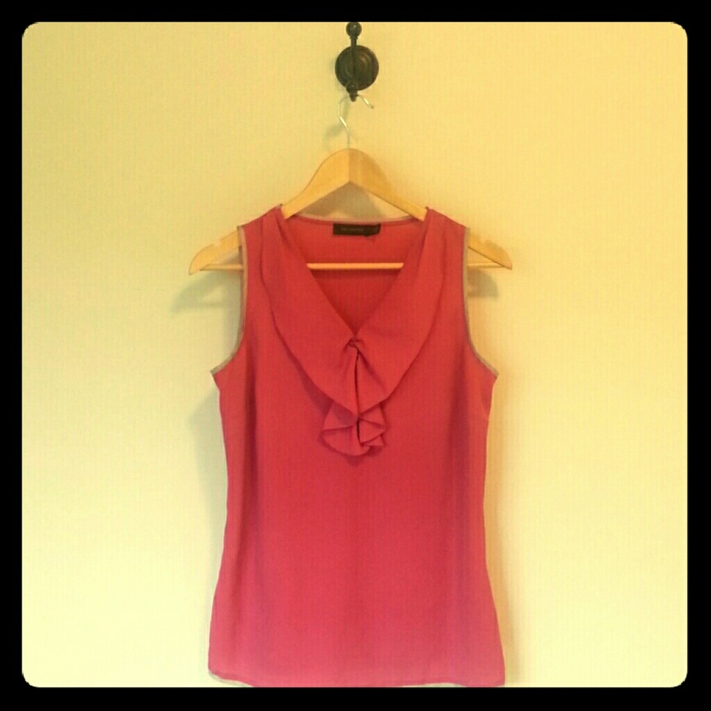 Pink blouse, grey trim.