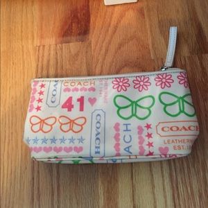 Small Coach makeup bag