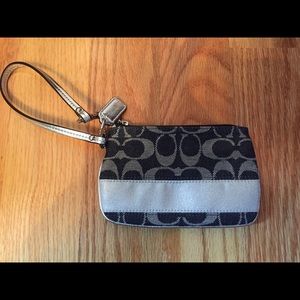 Silver and black Coach wristlet