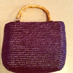 Cute, straw black bag with bamboo handles.