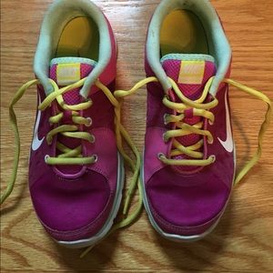 Pink, yellow, blue, and white Nike sneakers