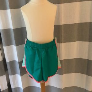 Blue and pink running shorts