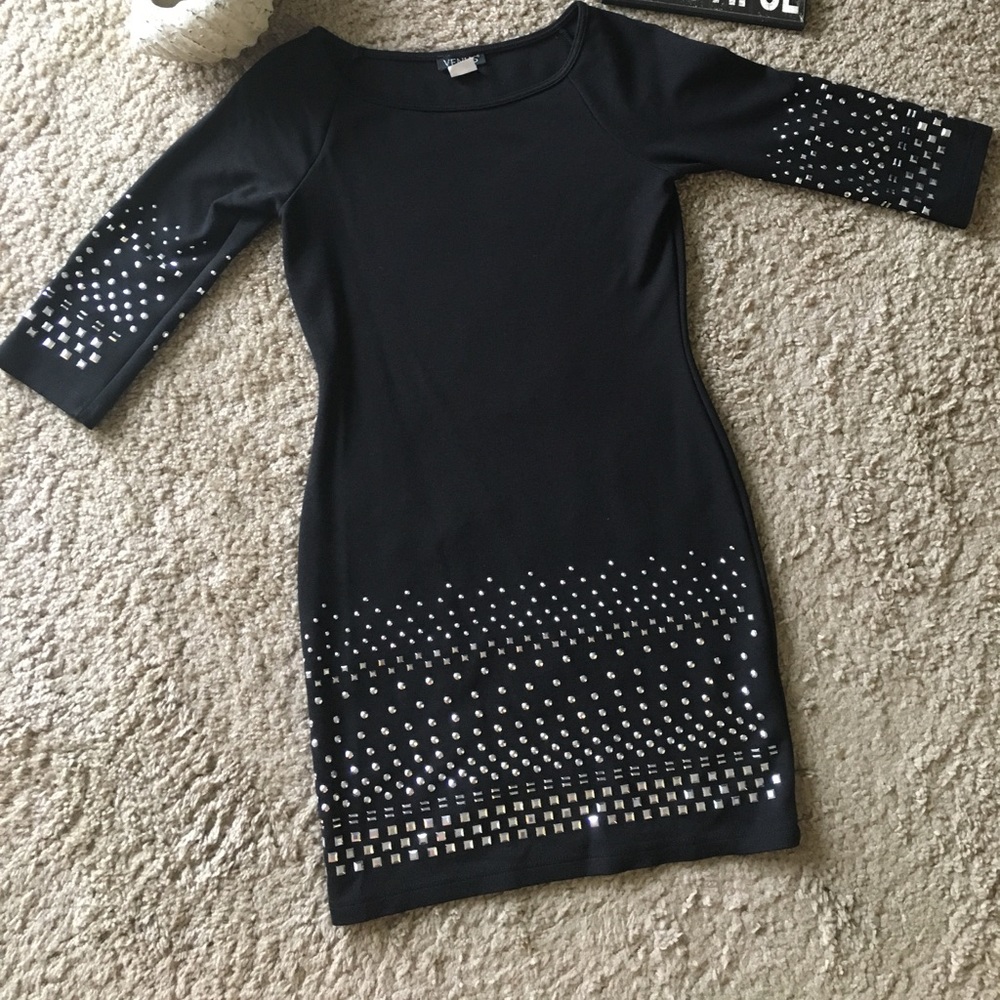 Black dress with silver studs as accent pieces