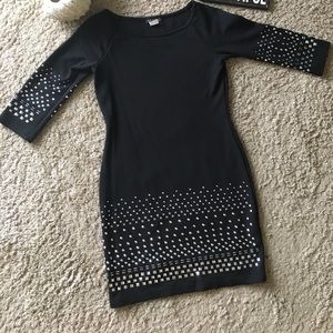 Black dress with silver studs as accent pieces