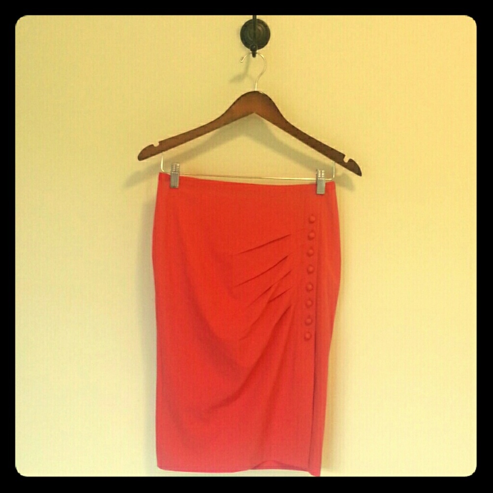 Pink skirt with flattering off center slit.