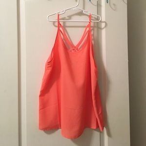 Hot pink tank top with cross back detailing