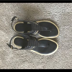 Also black and gold sandals