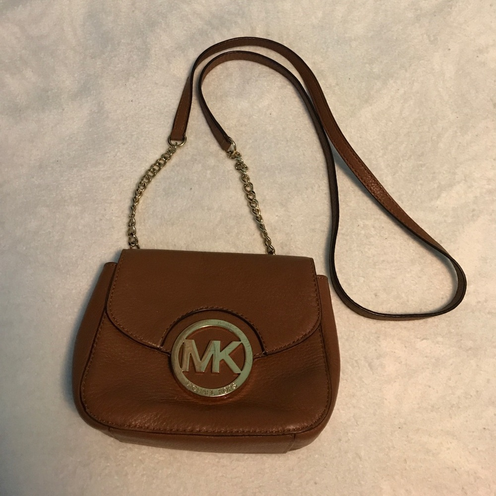 Brown and gold Michael Kors purse.