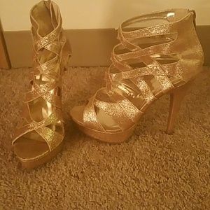 Gold strappy high heels