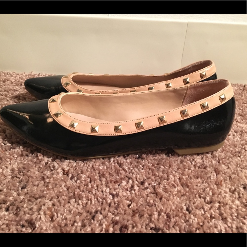 Black and beige studded flats