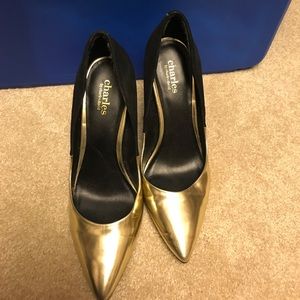 Gold and black pumps