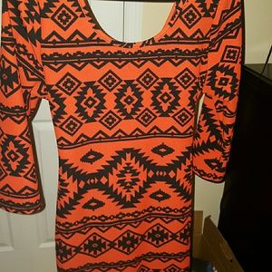 Super cute dress with a cut out back.