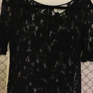 Black lace shirt with fringe detail and back zip!