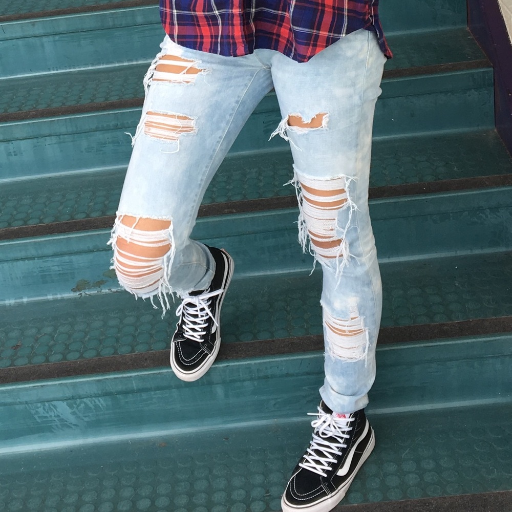 Distressed light acid wash denim jeans