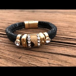 Embossed leather bracelet with gold accents