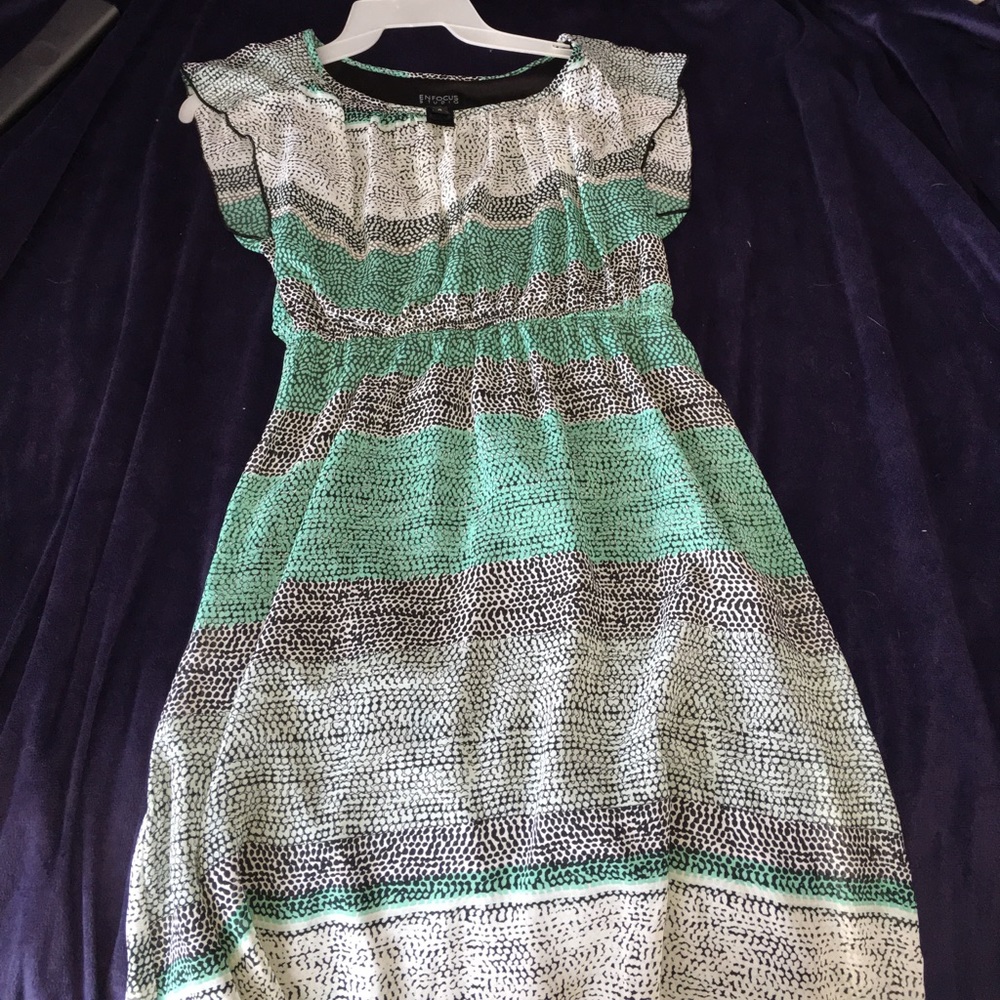 A turquoise,blacks and white dress