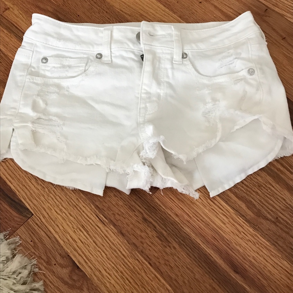 white ripped jean shorts