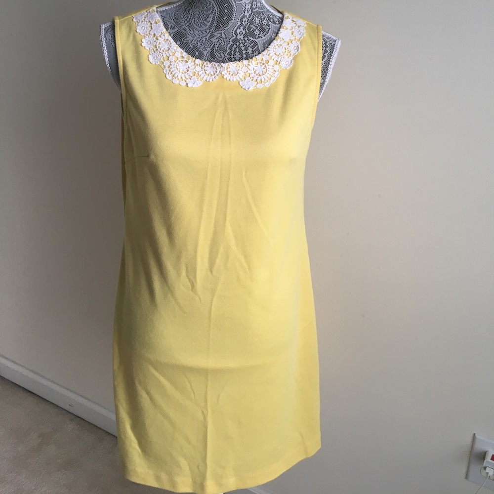 Yellow dress with white lace collar