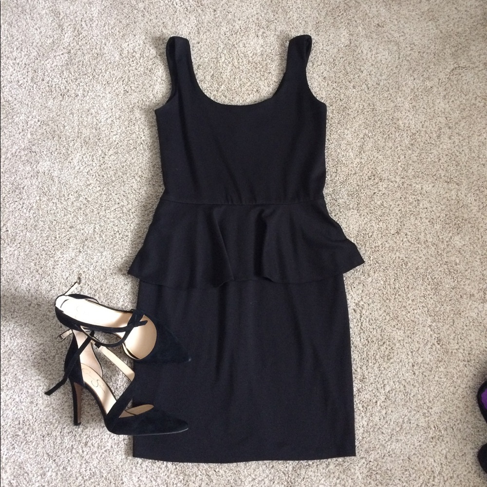Black peplum cocktail dress. Size L (8).