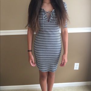 white, grey, and black striped body con dress.